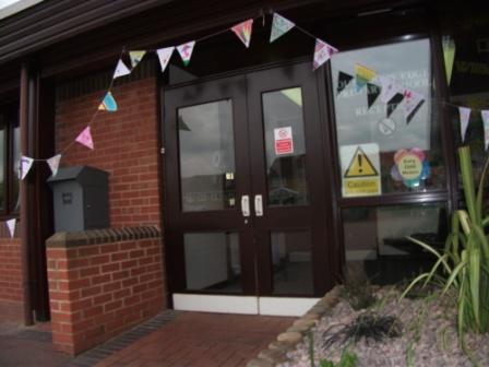 Bunting expressing hopes surrounds the school